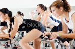 stock-photo-18215096-group-of-girls-spinning-on-bicycles-in-gym.jpg