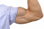 14213467-primer-plano-de-brazo-doblado-del-hombre-musculoso-con-la-manga-enrollada-sobre-fondo-b.jpg