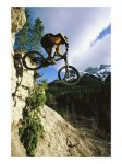 123287~Man-Jumping-on-His-Mountain-Bike-with-Ha-Ling-Peak-in-the-Background-Posters.jpg