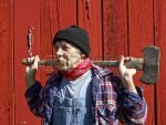 8240607-lumberjack-portrait-in-front-of-a-barn-with-an-ax-on-his-shoulders.jpg