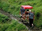 depositphotos_35088657-China-porters-carrying-tourist-in.jpg