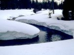 Creek_cutting_through_snow.jpg
