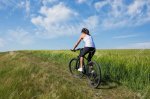 59275458-fit-woman-going-for-bike-ride-on-a-sunny-day-in-the-countryside.jpg